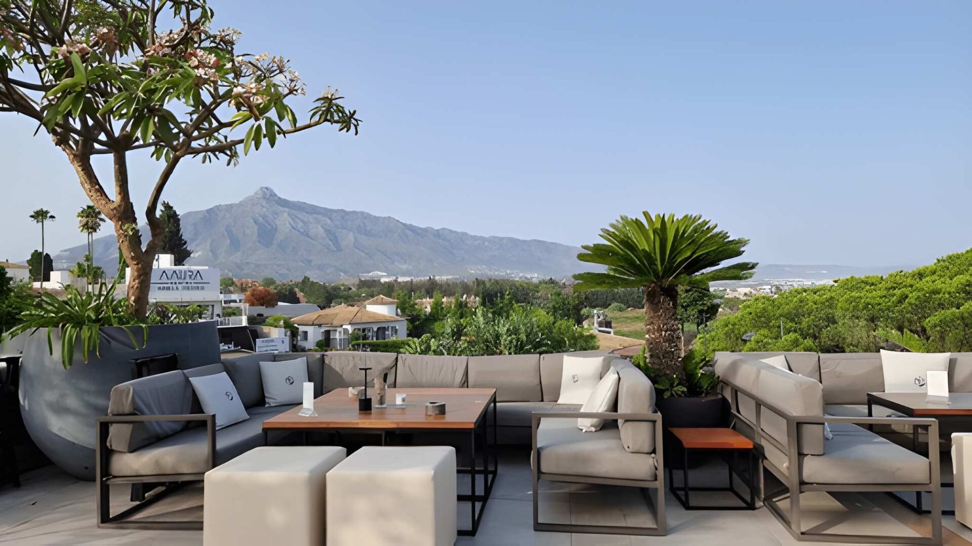 Rooftop bar in Marbella Spain overlooking the Mediterranean Sea showcasing luxury lifestyle vibrant nightlife and upscale living attractive to foreign property buyers in Marbella.