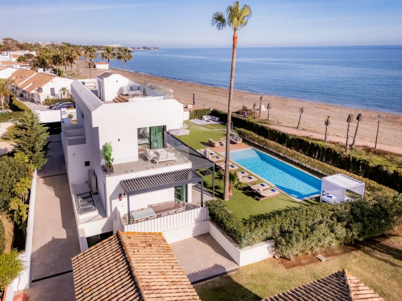 Front line beach designer villa with indoor and outdoor pool!