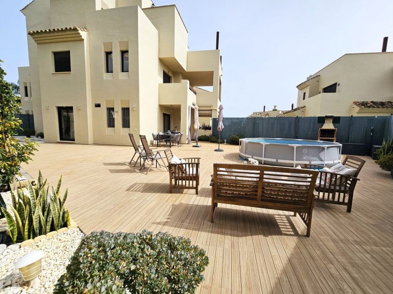 Stylish Elevated Ground Floor Apartment with Expansive Terrace & Private Garden in Selwo, Estepona