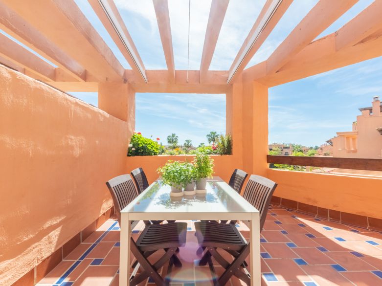 Exquisite beachside penthouse boasting a sprawling solarium terrace!